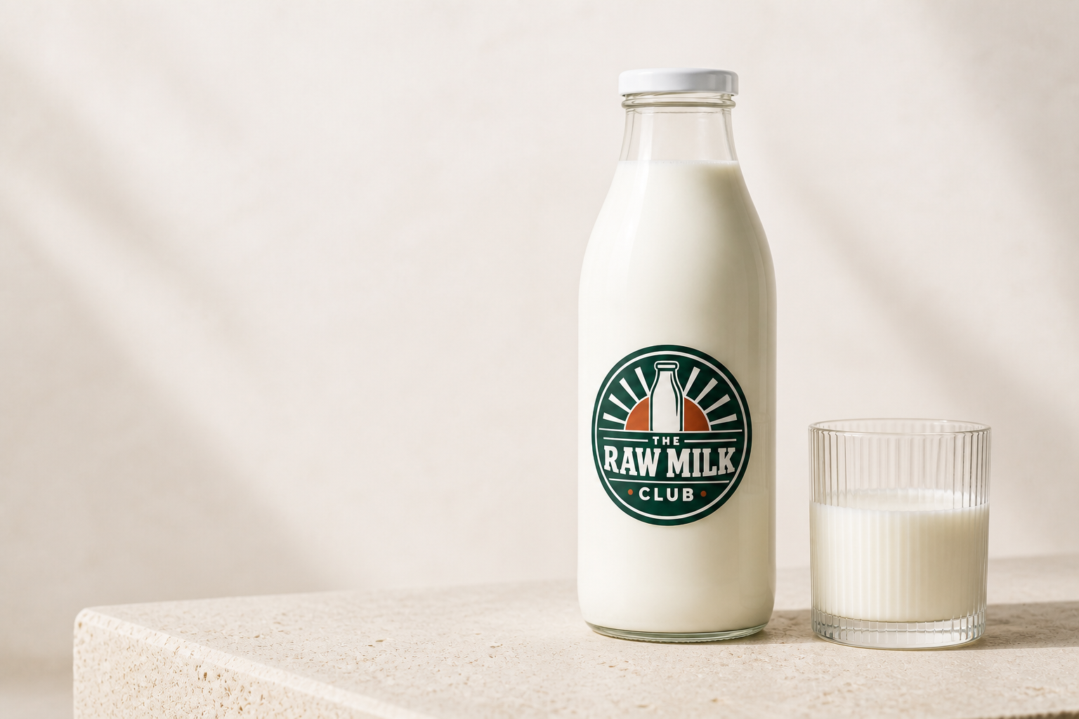 Illustrative Raw Milk Club-branded glass bottle filled with milk